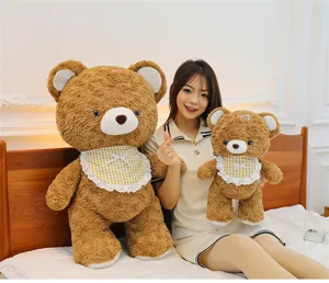 Detailed view of cute mocha brown plush bear toys set with plaid bibs for kids and girls gifts.