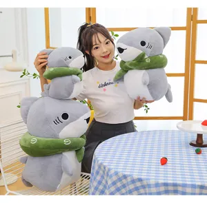 Cute gray shark plush toy with green scarf, soft stuffed animal doll for kids and room decor.