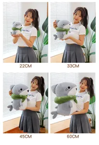 Cute cartoon gray shark plush toy with green scarf, soft hugging pillow and doll, multiple sizes.