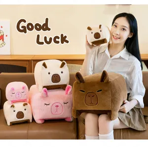 Detail view of cute square capybara plush toy and pillow, soft fabric, ideal home decor.
