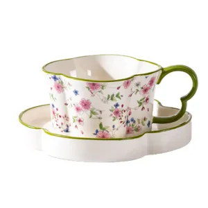 Juego de taza y platillo de café de cerámica de trébol de lujo con patrón floral té.
