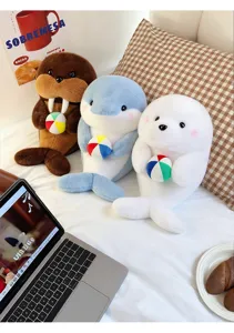 Cute plush seal, dolphin, and walrus stuffed animal dolls holding small colorful beach balls.