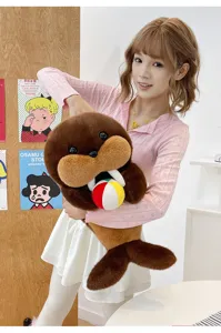 Cute brown plush walrus toy with soft fur, white tusks, and colorful ball detail.