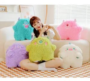 Cozy lifestyle detail scene featuring colorful fluffy one-eyed monster plush toys and model.