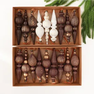 Top-down detail of vintage style finial Christmas ornaments set in a rustic kraft box