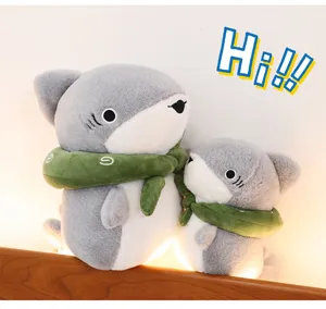 Cute grey shark plush toy with green scarf, soft stuffed animal pillow for kids and room decor.