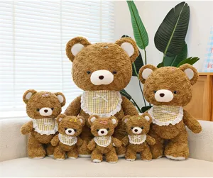 Detailed scene of cute brown curly teddy bear plush toys with checkered lace bibs.
