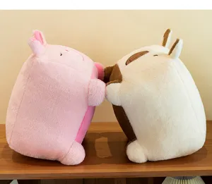 Detail view of cute cubic capybara plush toys hugging and playing, soft and cozy toy design.