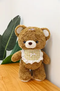 Brown mocha teddy bear plush toy with cute plaid bib and hair clip, soft sleeping doll gift.