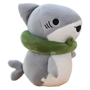 Cute shark plush toy with green scarf, soft stuffed animal pillow for kids and girls room decor.