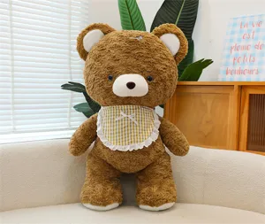 Charming mocha brown plush teddy bear toy with cute checkered bib detail, soft and cozy doll.