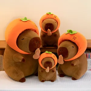 Cute capybara plush toy with persimmon hat holding peanut soft stuffed doll gift main view