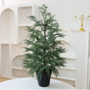 Detailed view of the lifelike simulated arborvitae Christmas tree in a minimalist black pot