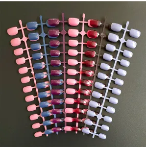 Close-up view of colorful fake nail strips, assorted false nails for daily art design.