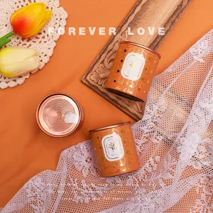 Canned Dahongpao tea gift tin set, elegant orange metallic packaging with gold patterns.