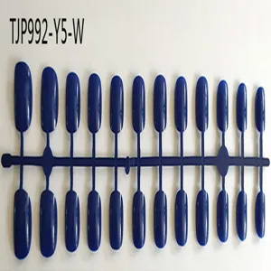 Detailed view of short square round unpainted dark blue false nail tips on sprue.