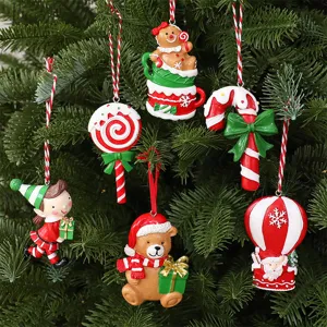 Detail showing six colorful resin Christmas ornaments hanging on a green festive tree