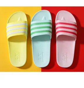 Closeup detail of colorful non-slip house slippers with soft soles designed for indoor bathroom daily use.