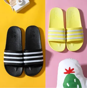 Detailed close-up of comfortable home slippers with classic striped design for indoor use.