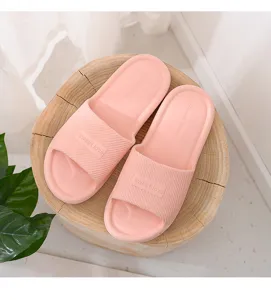Comfortable pink indoor home slippers featuring a non-slip sole and soft material.