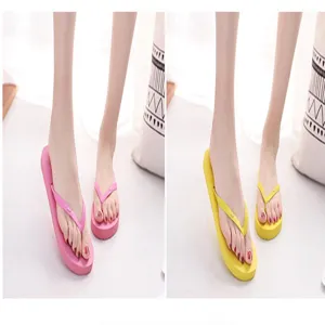 Detail view of summer flip-flops showing pink and yellow color variants with toe-post design.