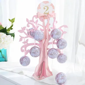 Wedding candy box set with pink wishing tree stand and marble tin ball containers for favors.