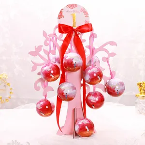 Wedding candy box tree set with pink spherical tin containers for romantic wedding decor.