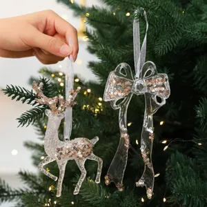Set di decorazioni natalizie trasparenti a forma di renna e fiocco con paillettes oro.