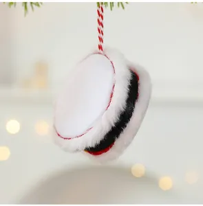 Detailed close-up of a plush fabric Christmas drum ornament with festive hanging cord