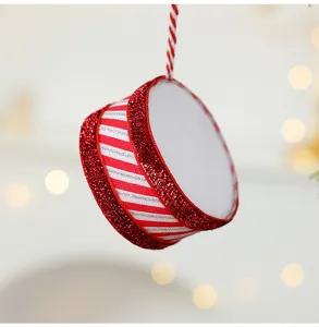 Festive red and white striped Christmas drum ornament with shimmering silver glitter accents.