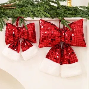 Large and small red sequin Christmas bow ornaments with white faux fur trim for holiday decor