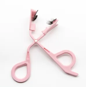 Pink magnetic false eyelash applicator clip tool for easy makeup and beauty styling.