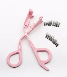Detailed close-up shot of pink plastic eyelash applicator tool and false lashes set, clear view.