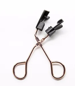 Magnetic eyelash curler for easy false lashes application with rose gold metal and black tips.