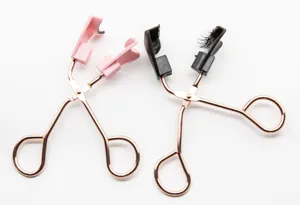 Professional magnetic eyelash curler tool with rose gold handle for easy false lash application.