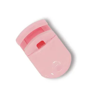 Portable mini plastic eyelash curler in pink, lightweight and compact makeup tool for travel.