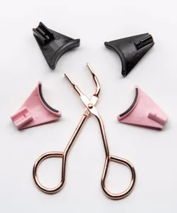 Magnetic eyelash curler with pink and black pads for easy glue-free makeup application beginner