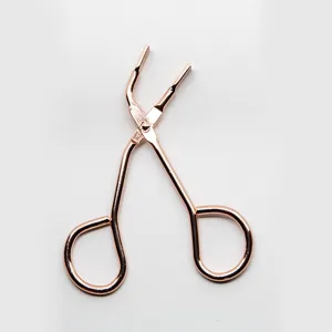 Rose gold magnetic eyelash curler tool for easy glue-free false lashes application.