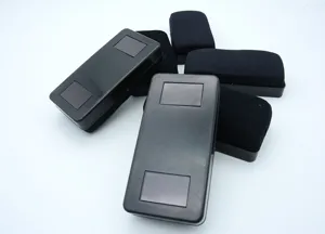 Magnetic whiteboard erasers with black plastic shell and fabric surface for office and school use.