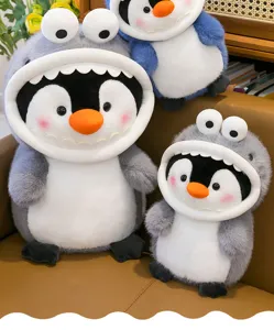 Close-up view of cute penguin shark plush toys detail, soft plush texture displayed on sofa.