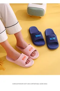 Comfortable soft anti-slip couple home slippers with cute bear design for bathroom indoor wear.