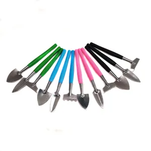 Mini metal garden tool detail, colorful plastic handles, succulent planting set close-up view.