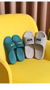 Comfortable non-slip couple home bathroom slippers in green and grey with cute bear design.