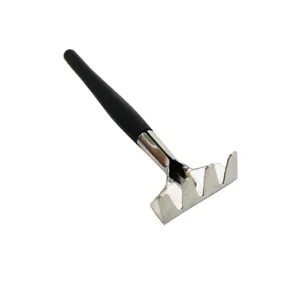 Mini garden rake detail metal head and black handle for succulent potted plants and small soil work.
