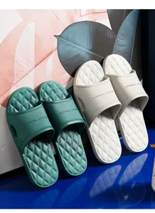 Detailed view of soft EVA couple home slippers with anti-slip diamond pattern soles in summer.