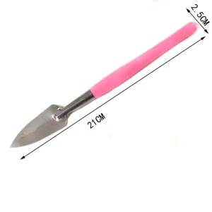 Detail view of mini gardening shovel with pink handle, compact size, perfect for potted plants.