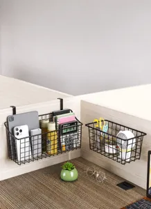 Detailed view of black wire hanging storage basket for office desk partition, space-saving organizer.