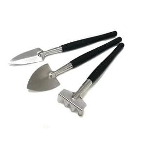 Mini gardening tool set with metal shovel rake and black handles for succulent potted plants.