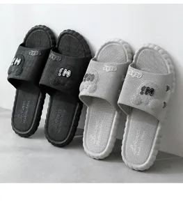 Comfortable indoor anti-slip couple slippers with cute bear design, perfect for home bathroom.
