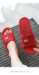 Summer non-slip soft sole couple home slippers detail showing cute bear design and texture.